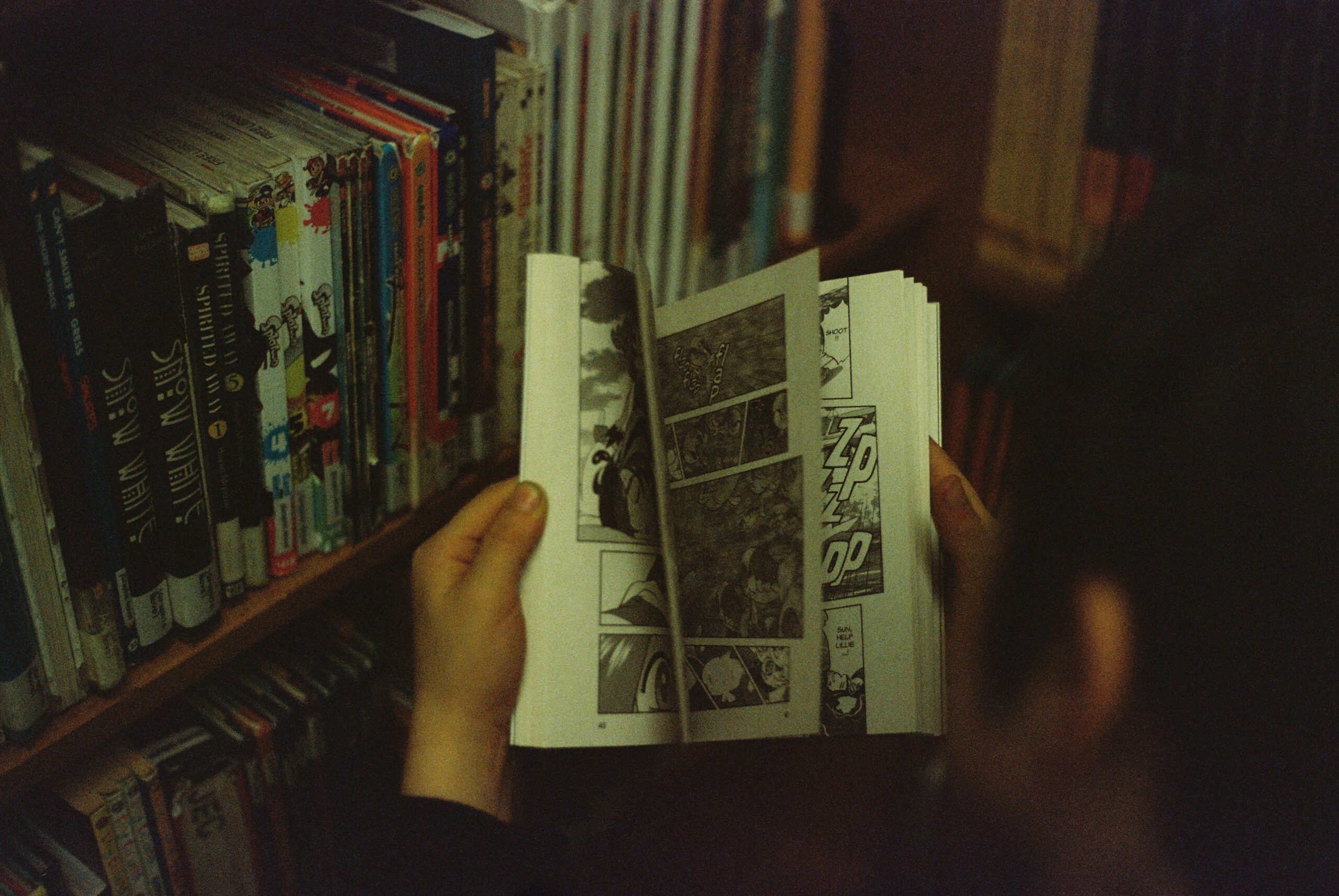 Man shuffling through comic book