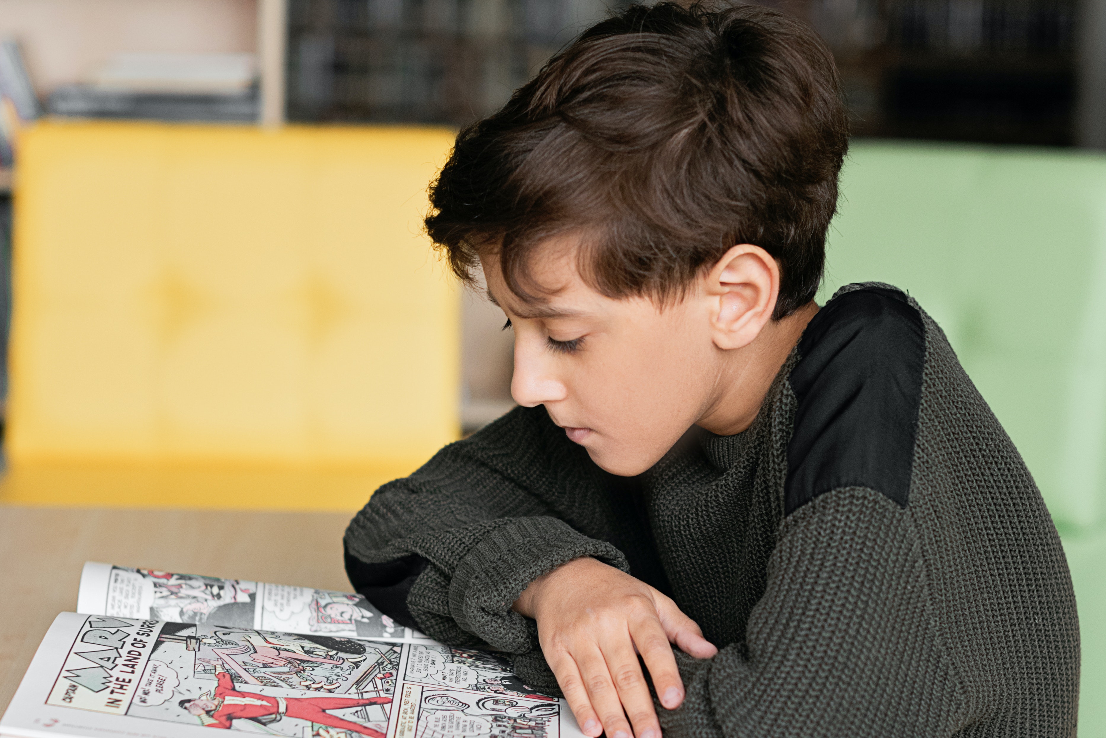 Boy reading a comic book