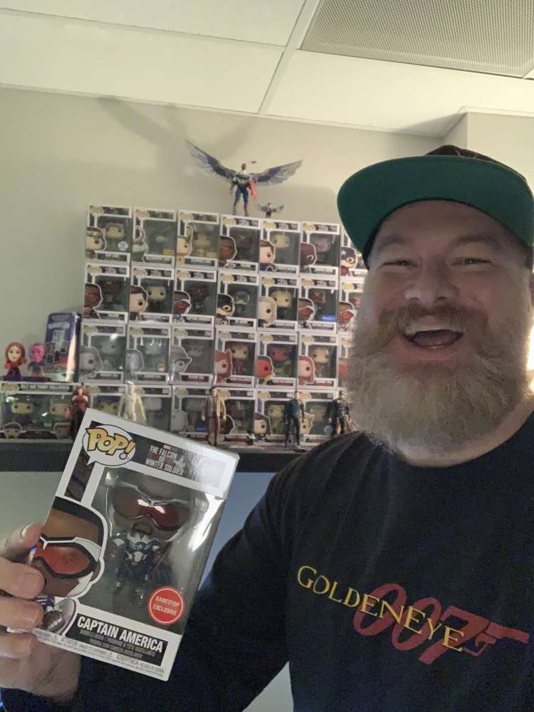 Jake with his Funko POP! collection