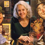 Jane Albright with her collection of OZ memorabilia
